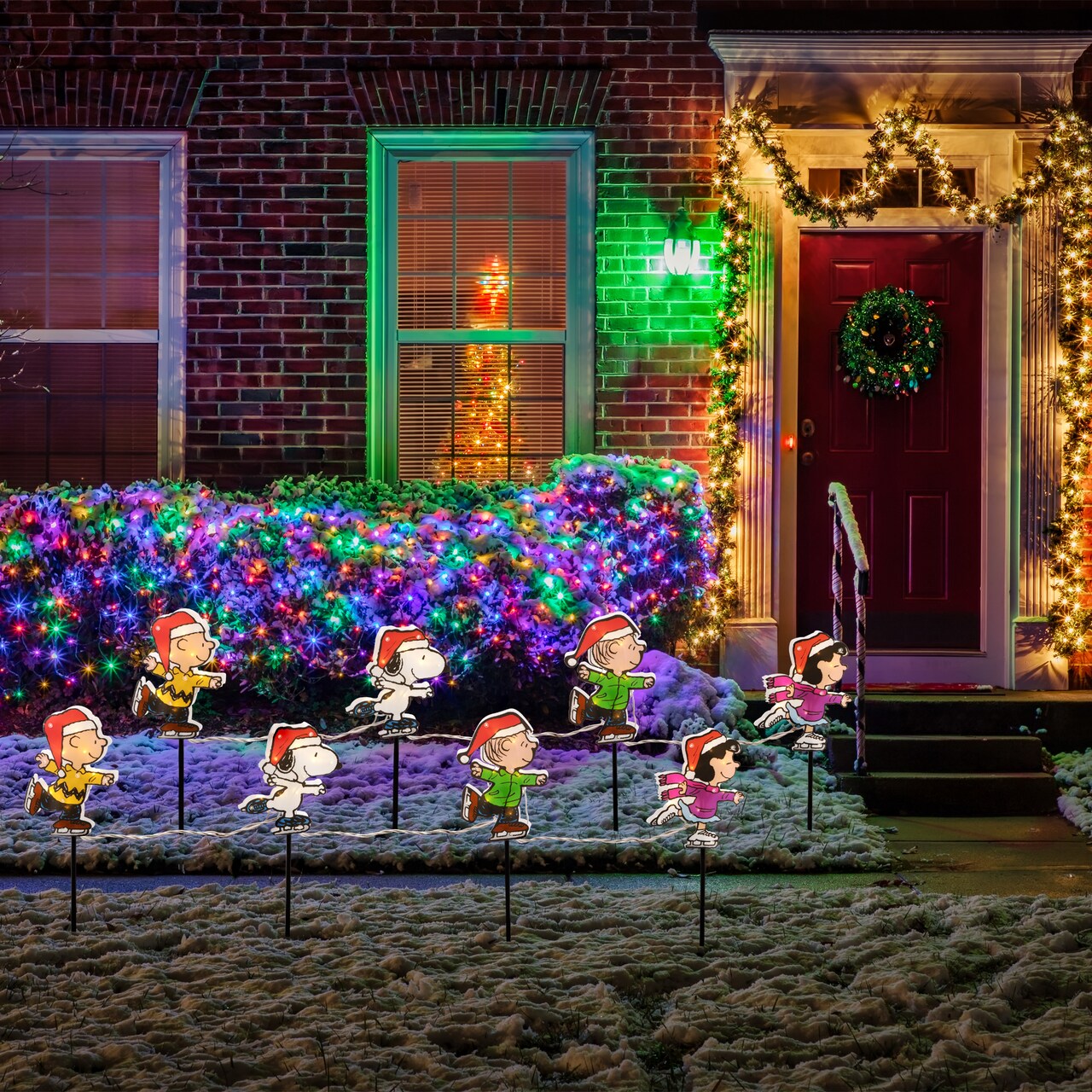 Northlight Lighted Snoopy and Peanuts Ice Skating Christmas Pathway Markers - Clear Lights - Set of 4
